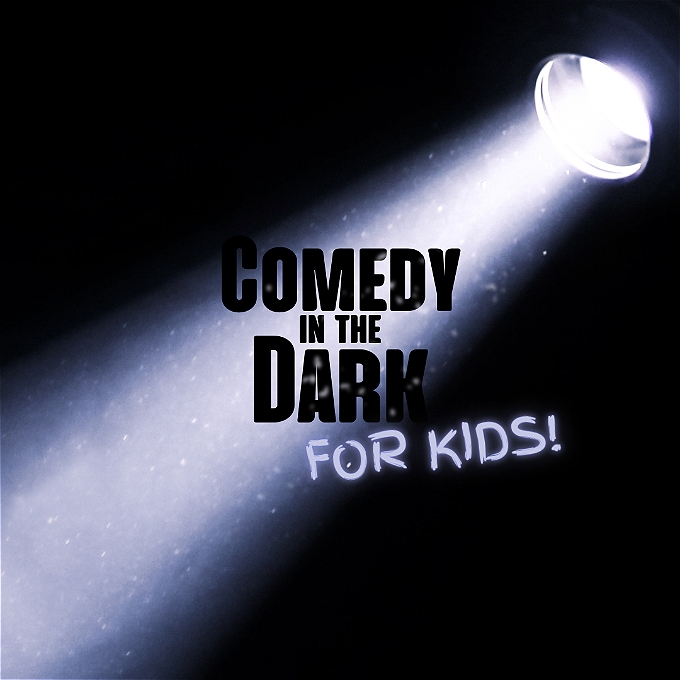 A flashlight beam shines down upon black text that reads 