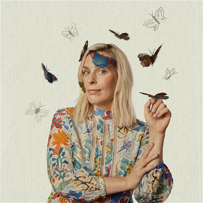 Sara Pascoe, comedian, on an off-beige background with butterflies.