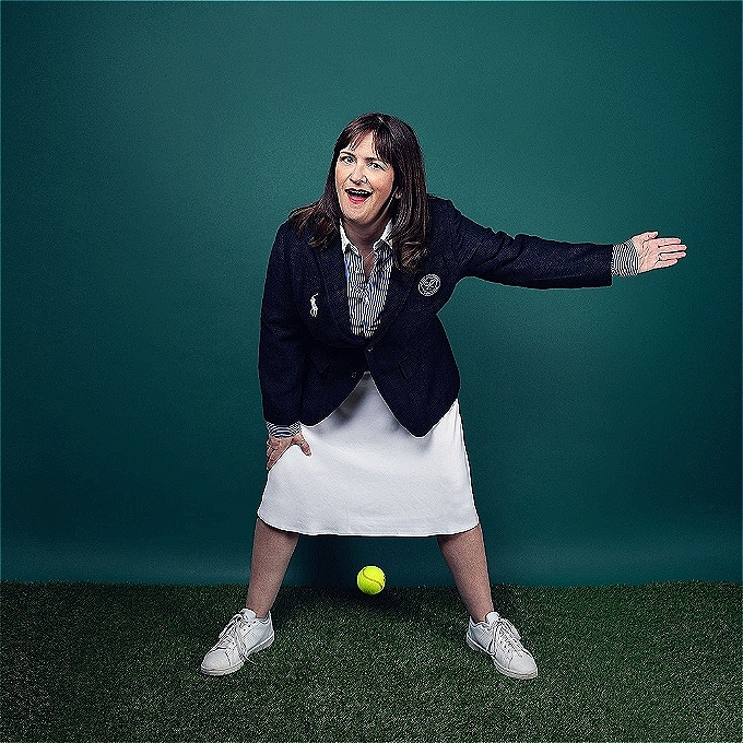 A female tennis line judge smiles wryly as she calls the ball out.