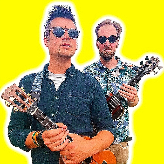 Two grown men holding ukuleles and attempting - and failing - to look cool.
