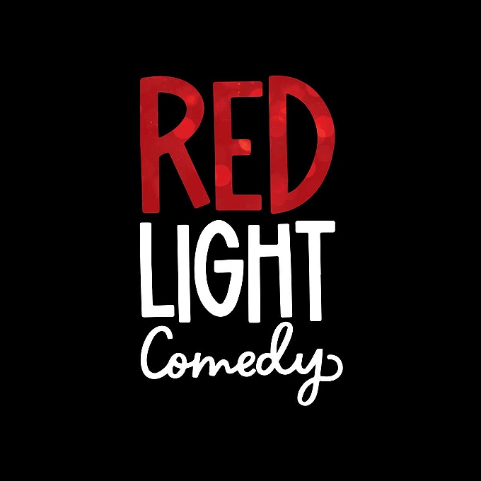 Red Light Comedy text on black background