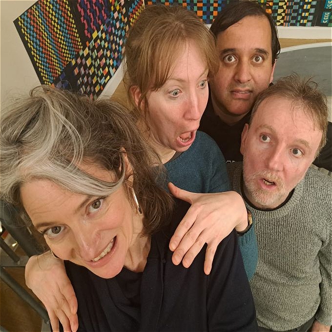 Two women and two men performers pulling faces over a patterned background