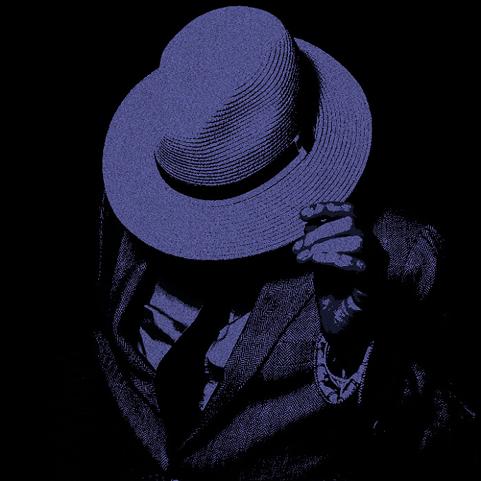 Dark blue lit image of a man in a suit leaning toward the camera, tugging on a wide-brimmed hat