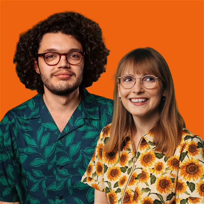 Male comedian in shirt and female comedian in sunflower jumpsuit