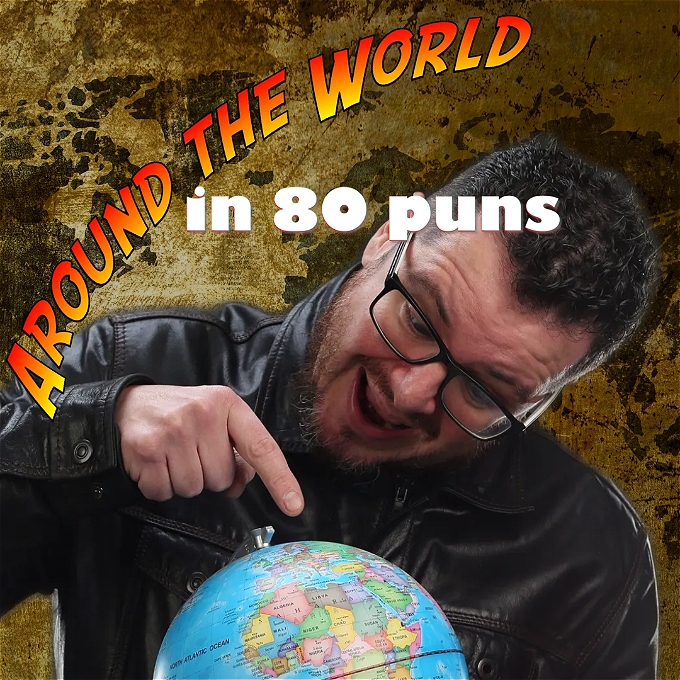 male comedian pointing at a globe