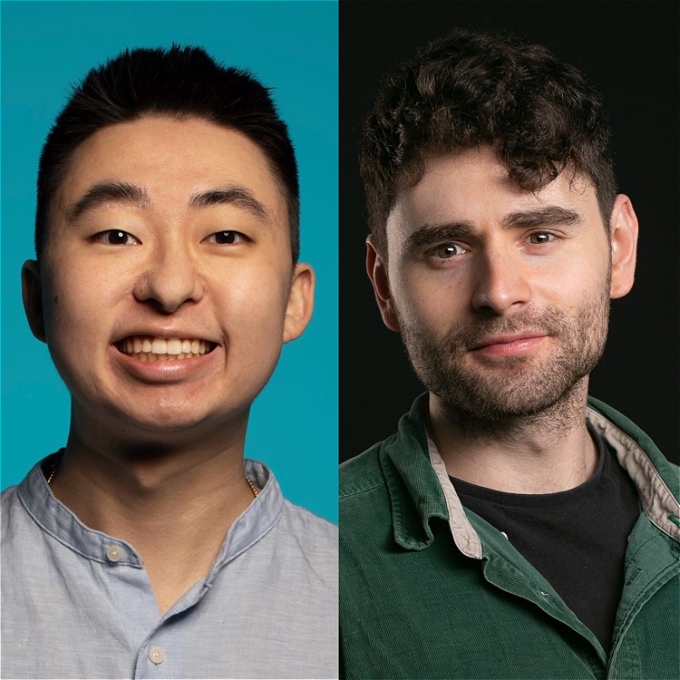 Two smiling comedians in front of a plan background