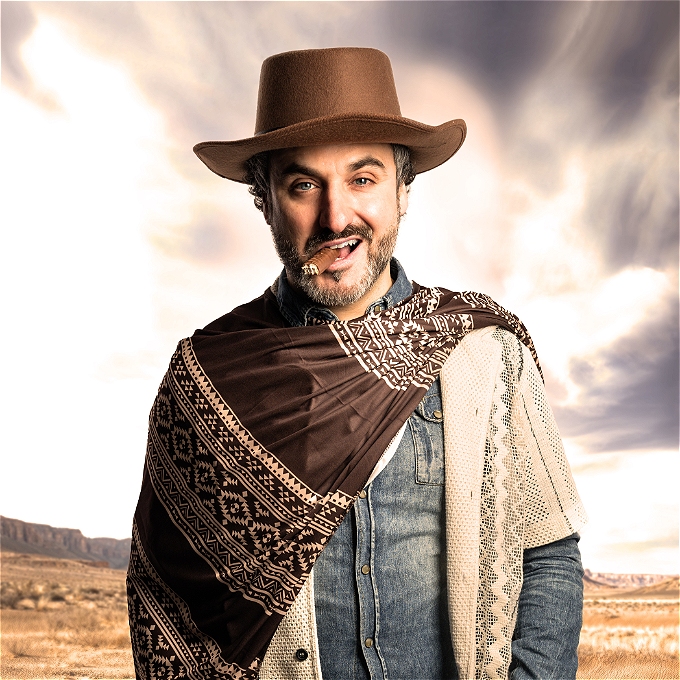 Patrick Monahan dressed as a cowboy with a nearly finished cigar