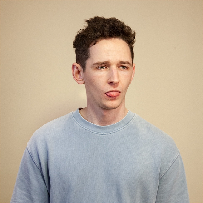 Milo standing up with his tongue sticking out