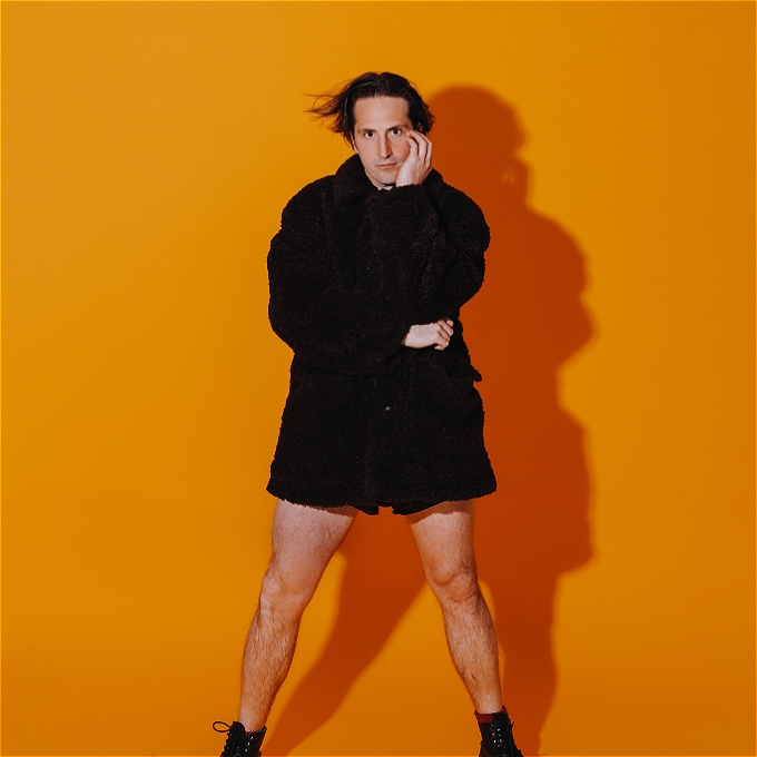 Luke McQueen looks coquettishly at the camera