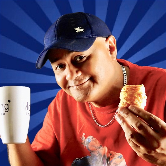 Comedian Nik Coppin with his trademark smile and baseball cap