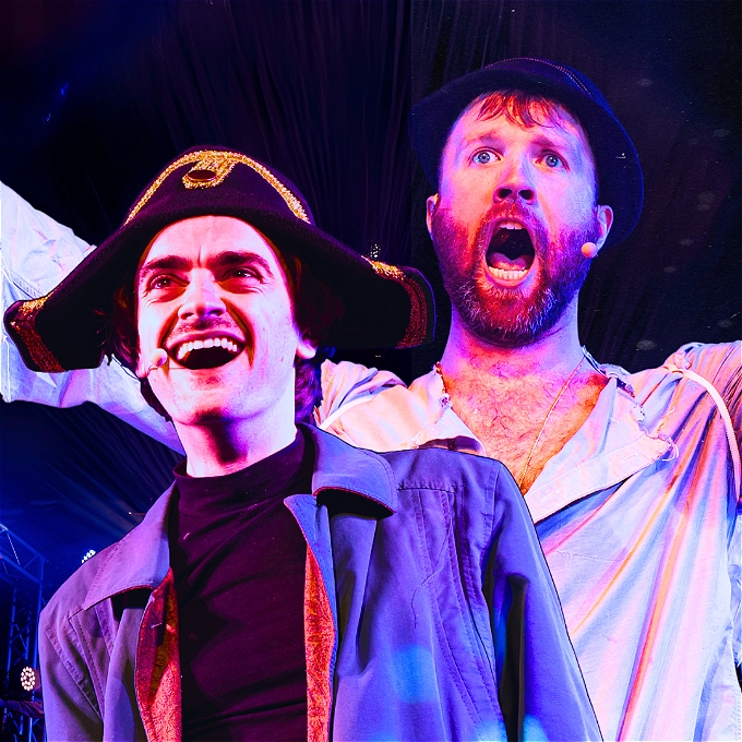 Two comedians dressed as characters from Les Miserables. One is dressed as a French policeman, the other has a beard and is dressed in rags