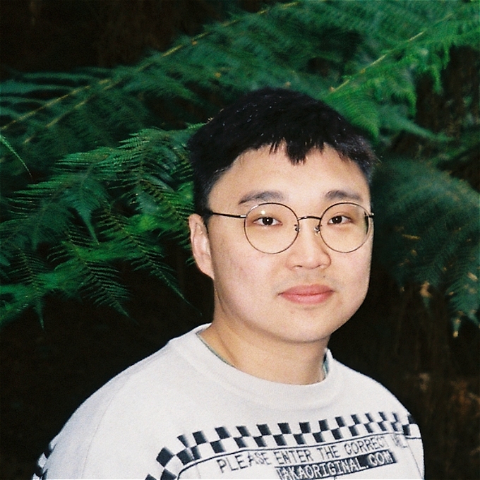 Jin Hao-Li looks at the camera with a neutral expression