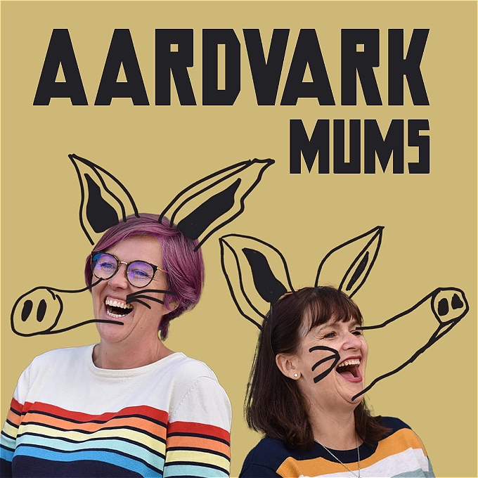 laughing comedians Louise Leigh & Pauline Eyre, with aardvark ears & snouts grafitti'd on to their heads.