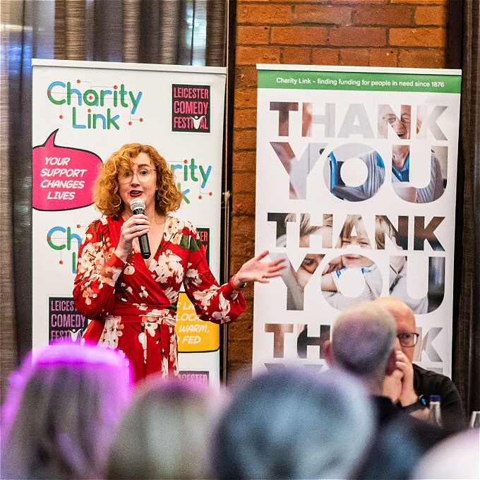 Charity Link CEO opening the comedy night
