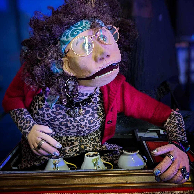 Nanny Cynthia puppet with tea cups and mind reading powers.