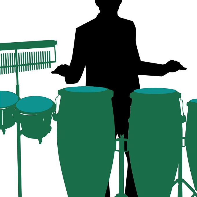 Man in trilby hat drumming