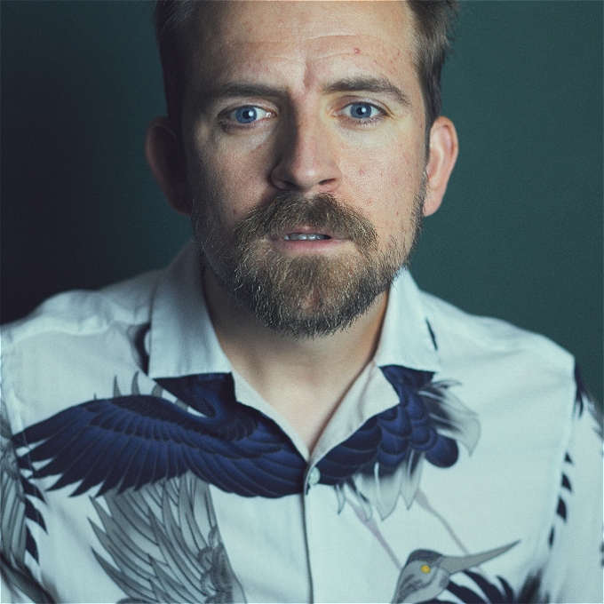 Male Comedian with a bird shirt