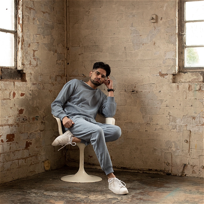 Rahul Somia is sitting on a chair