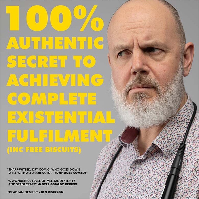 Confused looking comedian glances askance at his show title