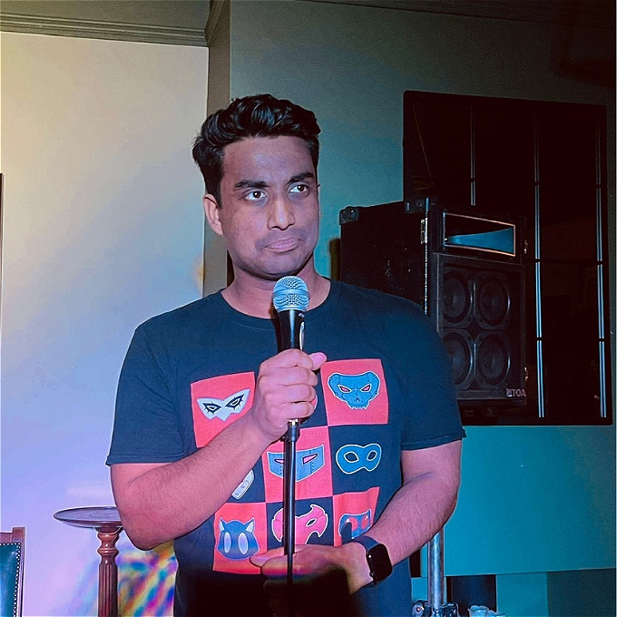 Man standing with a microphone