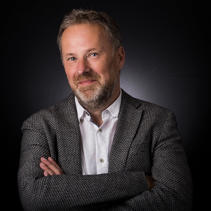 Male comedian with salt and pepper hair