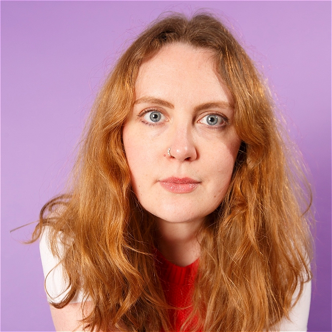 Emmeline looks intently at the camera