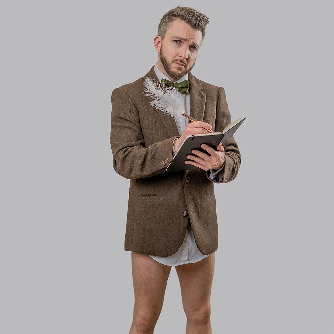 Male comedian in top half suit and no trousers.