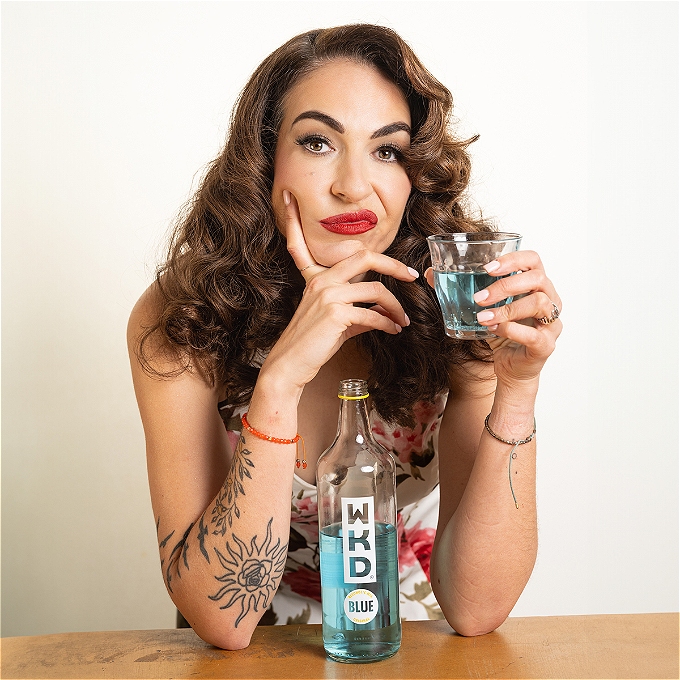 Esther Manito with a bottle of Blue WKD