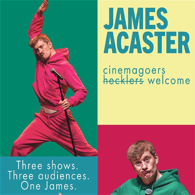Comedian James Acaster holds a microphone stand whilst wearing a pink hoody